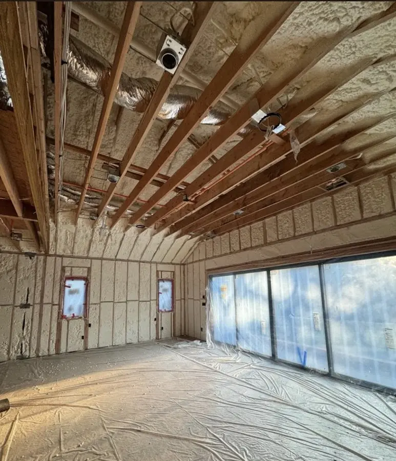 Interior walls and ceiling insulated with spray foam during new construction in Oil City